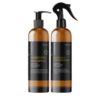 Two bottles of sensitive shampoo and conditioner on a white background