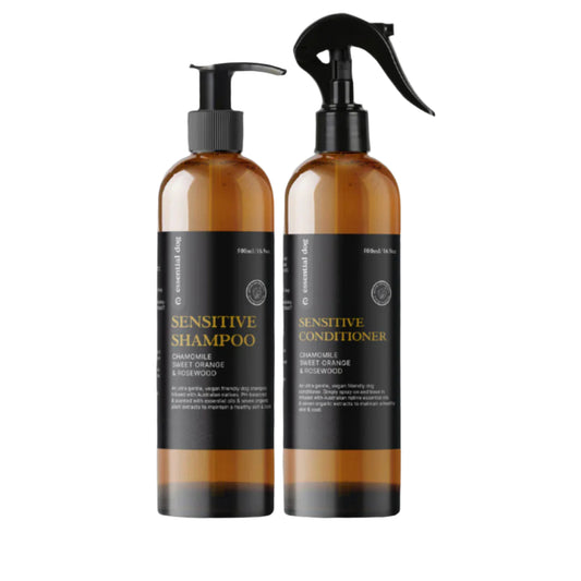 Two bottles of sensitive shampoo and conditioner on a white background